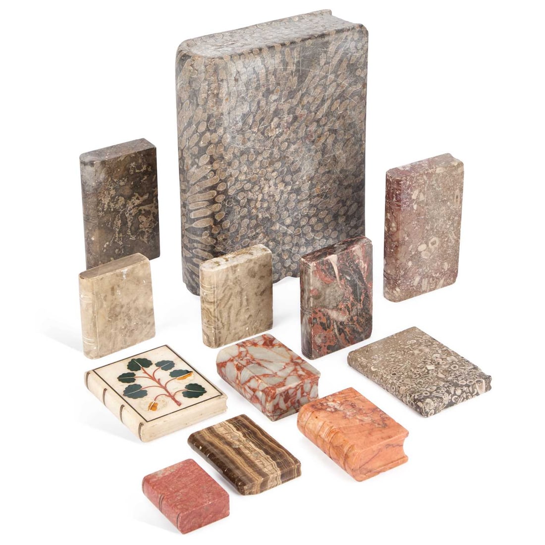 A COLLECTION OF 19TH/ EARLY 20TH CENTURY MARBLE BOOK-FORM PAPERWEIGHTS AND NOVELTIES: A COLLECTION OF 19TH/ EARLY 20TH CENTURY MARBLE BOOK-FORM PAPERWEIGHTS AND NOVELTIES variously carved and polished in assorted marbles and hardstones including fossil marble examples, one inset with p