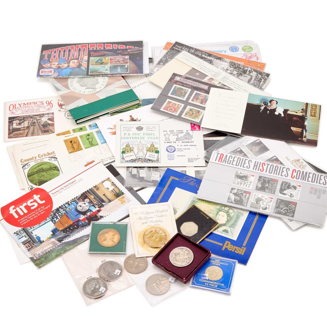 A GROUP OF FIRST DAY COVER STAMPS AND COINS: A GROUP OF FIRST DAY COVER STAMPS AND COINS including a Westminster Collection Collector's Edition Mallard train coin, in the original packaging; a Royal Mint 50 Years of the 50p British Military set;