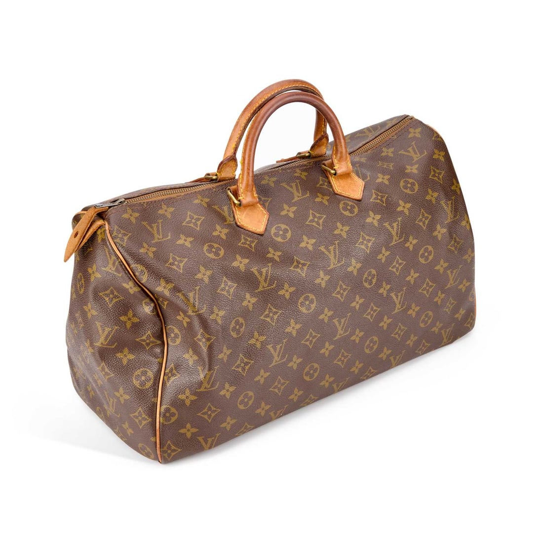 A LOUIS VUITTON SPEEDY 40 BAG: A LOUIS VUITTON SPEEDY 40 BAG monogrammed coated canvas with vachetta trim and rolled handles, with one interior pocket, brass tone hardware, stamped date code for March 1983. 40cm wide