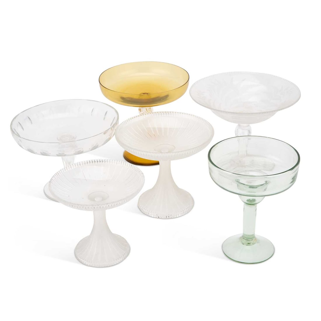 A VICTORIAN ENGRAVED GLASS TAZZA: A VICTORIAN ENGRAVED GLASS TAZZA engraved with ferns; together with five further examples. (6) First 17cm high
