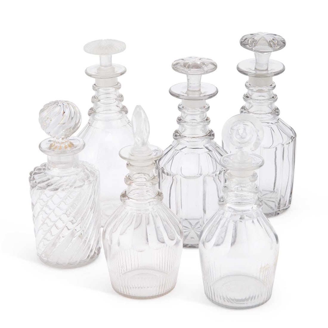 A COLLECTION OF DECANTERS AND STOPPERS EARLY 19TH CENTURY AND LATER: A COLLECTION OF DECANTERS AND STOPPERS EARLY 19TH CENTURY AND LATER (6) Tallest 25cm