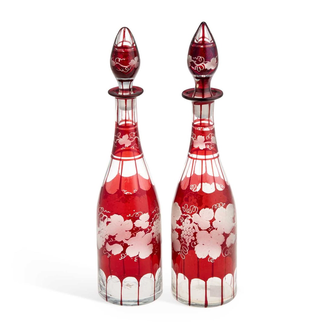 A NEAR PAIR OF RUBY GLASS DECANTERS AND STOPPERS (1 of 1)