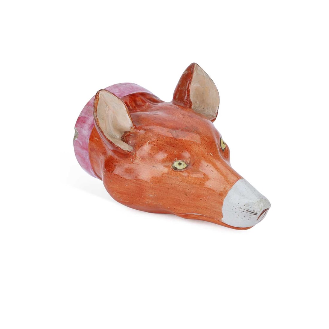 A STAFFORDSHIRE POTTERY FOX HEAD STIRRUP CUP CIRCA 1830: A STAFFORDSHIRE POTTERY FOX HEAD STIRRUP CUP CIRCA 1830 modelled as a fox head, decorated in enamels. 12cm long Repair to ears, chip to collar.