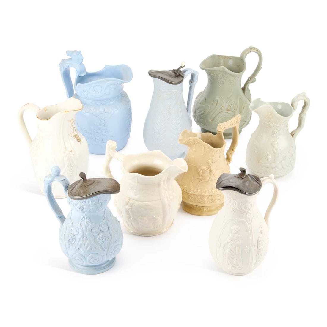 A QUANTITY OF STAFFORDSHIRE RELIEF MOULDED JUGS CIRCA 1840 (1 of 1)