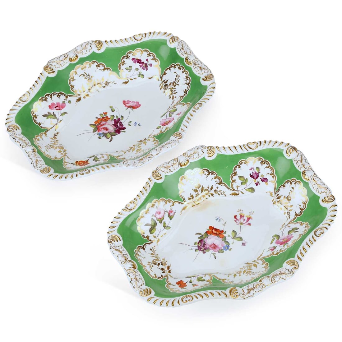 A PAIR OF ROCKINGHAM DESSERT DISHES CIRCA 1830: A PAIR OF ROCKINGHAM DESSERT DISHES CIRCA 1830 each painted with a central bouquet of flowers and reserves of specimen flowers, the rims gilt on a green ground, pattern no. 591. (2) 30cm wide