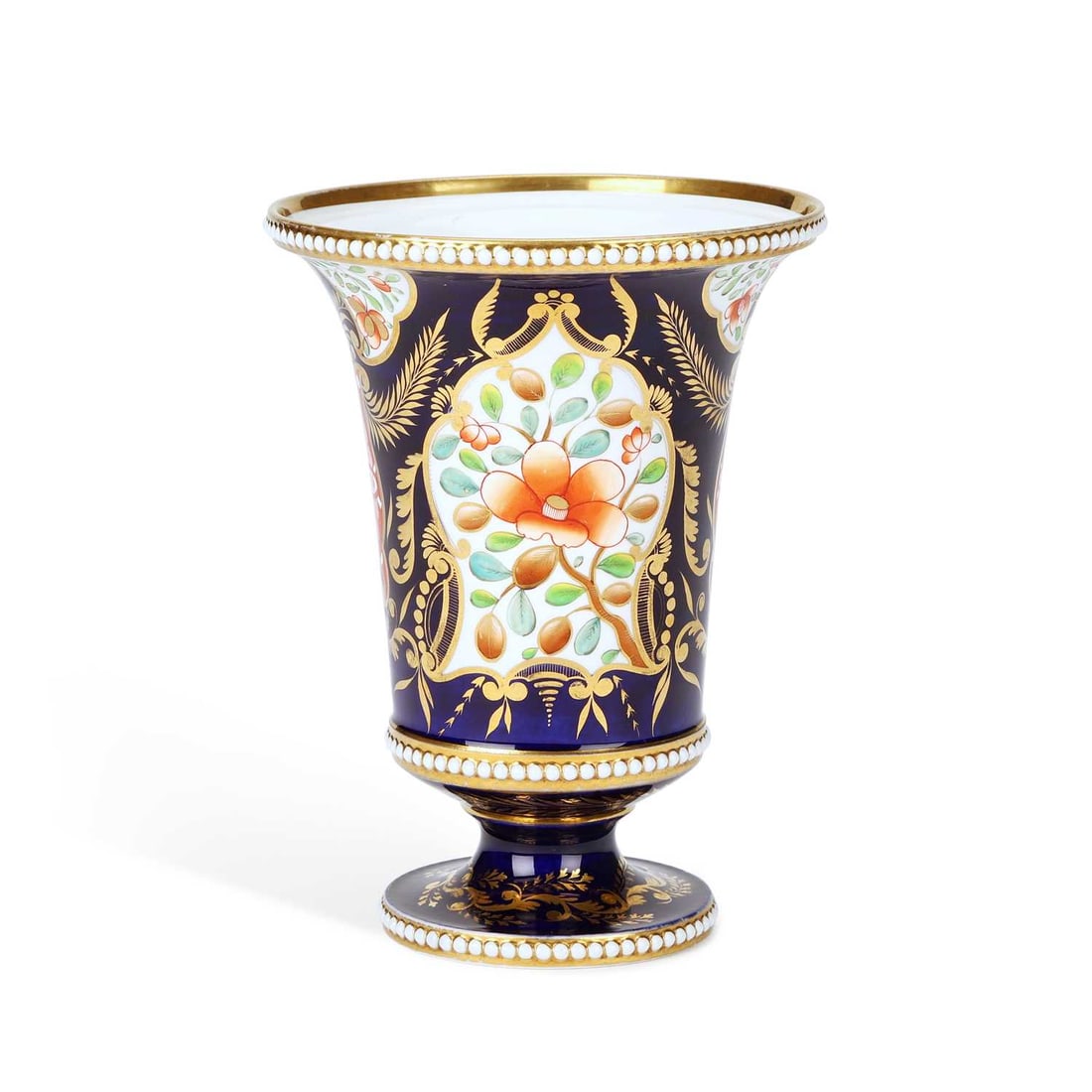 A SPODE PORCELAIN VASE CIRCA 1815: A SPODE PORCELAIN VASE CIRCA 1815 the flared beaker vase, decorated in the Imari style with flowers and foliage within shaped cartouches, richly gilt on a cobalt ground with white beaded borders,