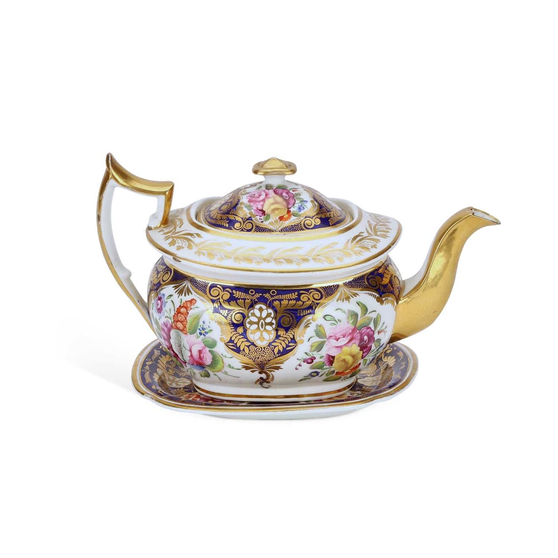 A COALPORT PORCELAIN TEAPOT AND STAND CIRCA 1830: A COALPORT PORCELAIN TEAPOT AND STAND CIRCA 1830 the teapot hand-painted with sprays of flowers on a cobalt blue ground, heightened with gilt, the stand decorated en suite. (2) Teapot 26.5cm long
