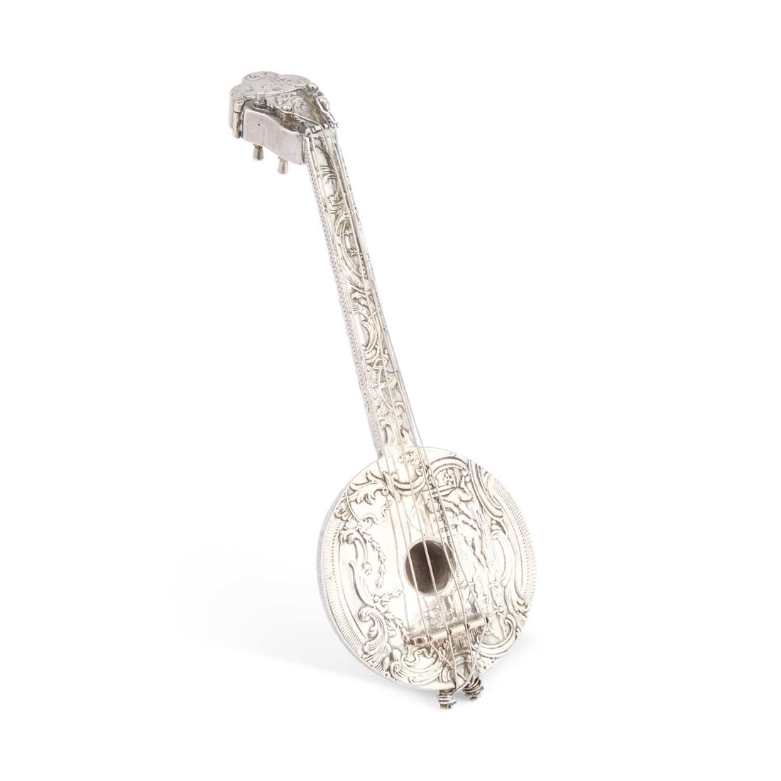 A CONTINENTAL SILVER NOVELTY SCENT BOTTLE: A CONTINENTAL SILVER NOVELTY SCENT BOTTLE in the form of a mandolin, the top of the headstock with a hinged cover opening to reveal the scent bottle, embossed with scrolling foliage and vignettes of p