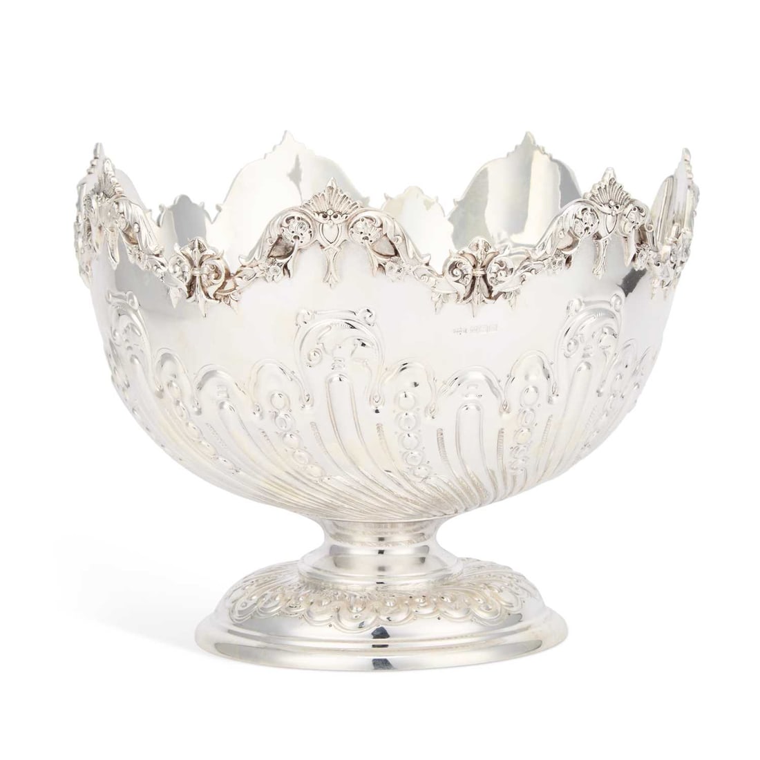 A LARGE EDWARDIAN SILVER PUNCH BOWL: A LARGE EDWARDIAN SILVER PUNCH BOWL by James Dixon & Sons Ltd, Sheffield 1904, of circular form with rounded and chased sides below a scroll and foliate rim. 21.5cm high, 26cm diameter, 50.5 troy 