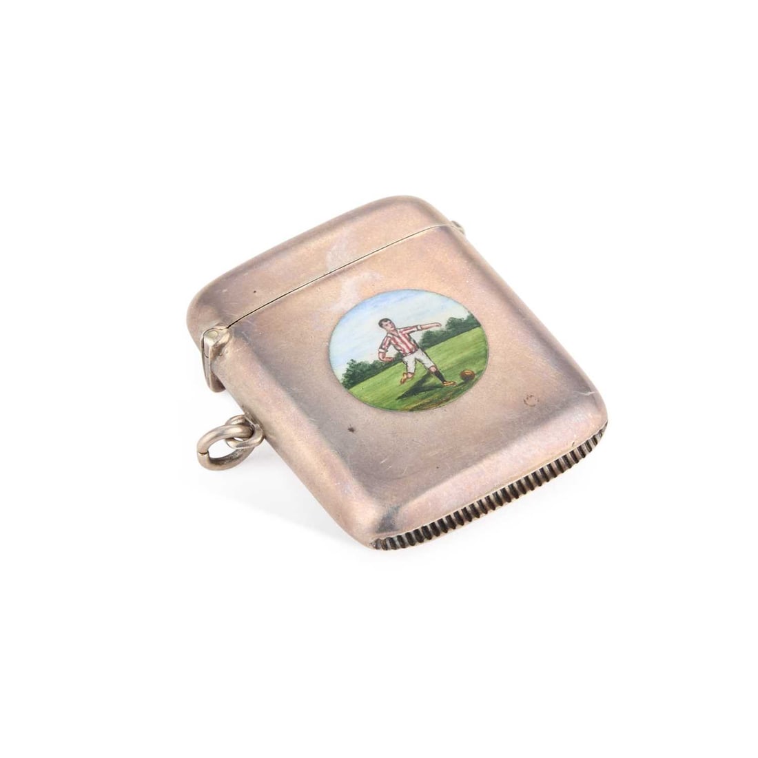 A GEORGE V SILVER AND ENAMEL VESTA CASE: A GEORGE V SILVER AND ENAMEL VESTA CASE by George Randle, Birmingham 1921, of rectangular form with a hinged cover, the front enamelled with a roundel depicting a footballer. 5.5cm by 4.3cm (excl.