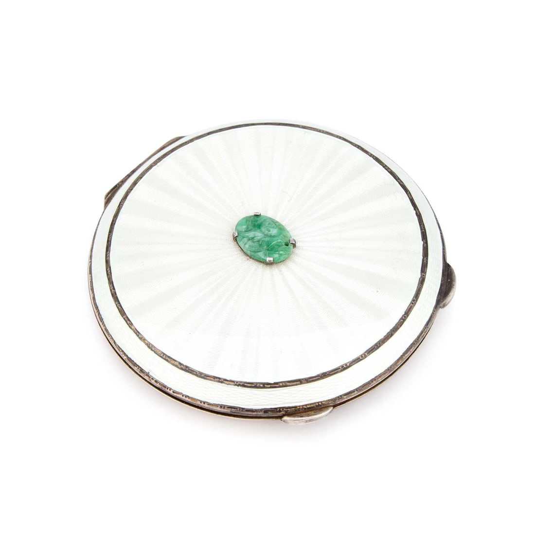 AN ELIZABETH II SILVER, ENAMEL AND JADE COMPACT: AN ELIZABETH II SILVER, ENAMEL AND JADE COMPACT by Henry Clifford Davis, Birmingham 1963, of circular form, the hinged cover centred by an oval carved jade plaque. 8cm diameter, 3.9 troy ounces gross