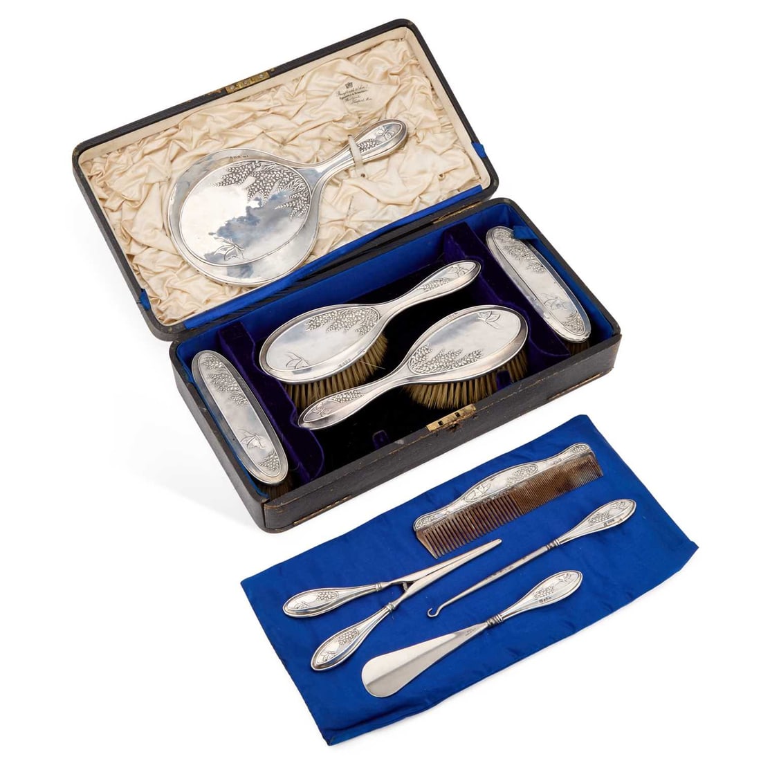 A GEORGE V SILVER-MOUNTED DRESSING TABLE VANITY SET: A GEORGE V SILVER-MOUNTED DRESSING TABLE VANITY SET by W J Myatt & Co, Birmingham 1911 and 1912, comprising a hand-mirror, two hair brushes, two clothes brushes, a comb, glove stretcher, button ho