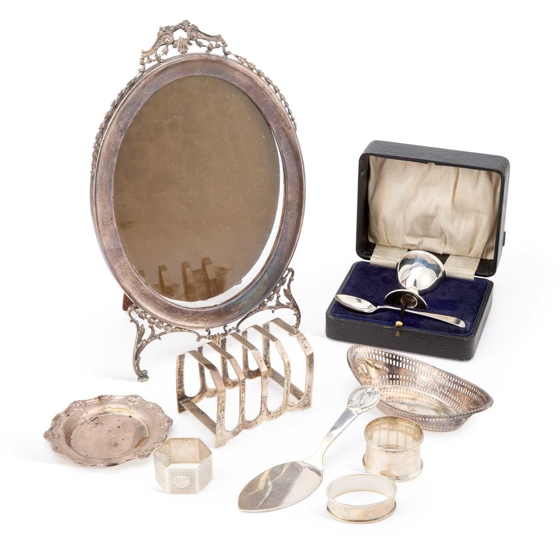 A GROUP OF SILVER: A GROUP OF SILVER including a five-bar toast rack; oval easel-back photograph frame; etc. (Qty) Photograph frame 30cm high, weighable silver 11 troy ounces gross (excl. frame)