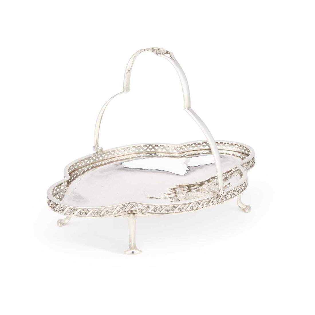 A.E. JONES, AN ARTS AND CRAFTS SILVER BASKET: A.E. JONES, AN ARTS AND CRAFTS SILVER BASKET by Albert Edward Jones, Birmingham 1921, of quatrefoil shape with galleried sides and pierced lattice, chased flowers between very fine bands of beading, t