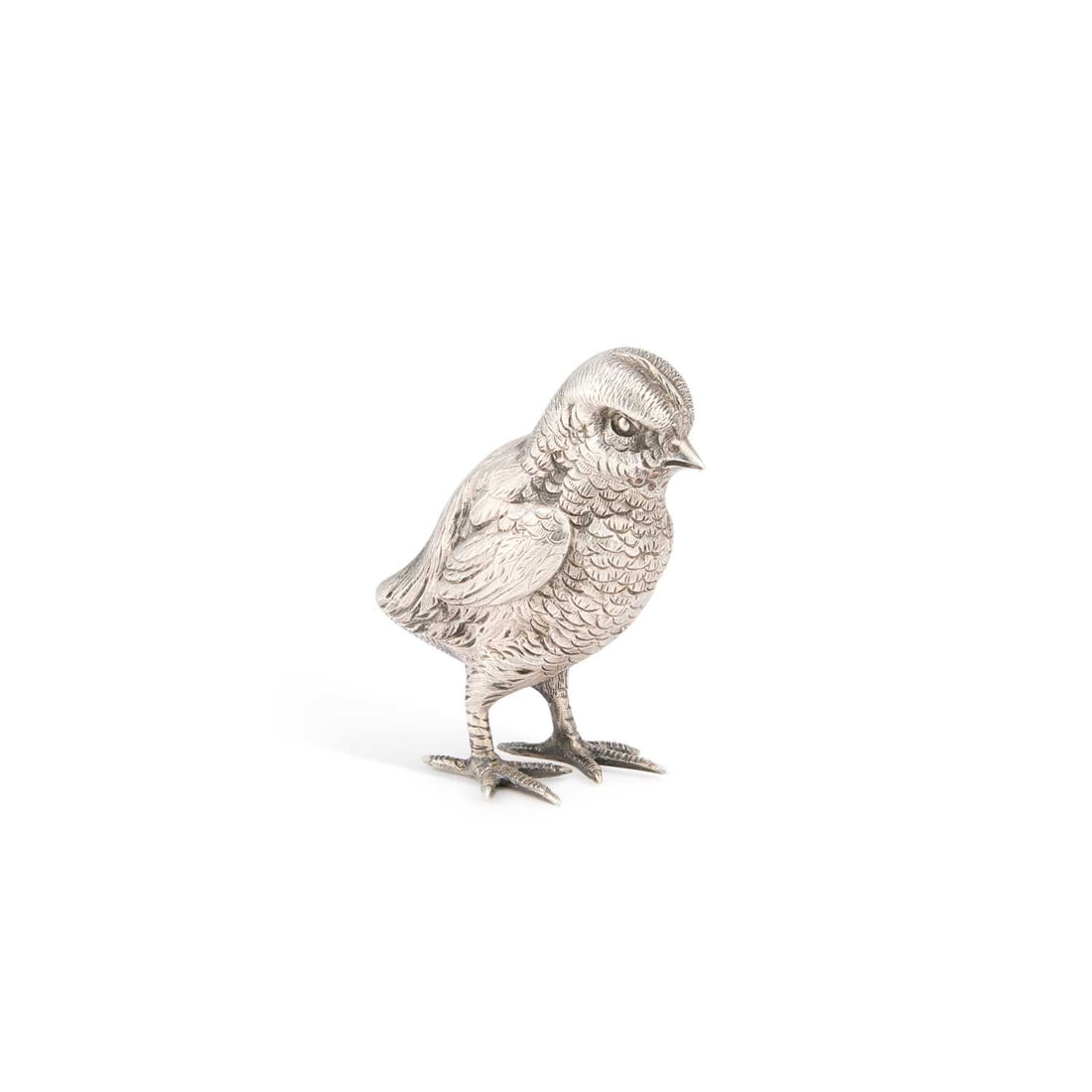 A VICTORIAN SILVER NOVELTY PEPPER POT: A VICTORIAN SILVER NOVELTY PEPPER POT by Jane Brownett, London 1882, realistically cast in the form of a standing chick with finely detailed plumage, the head detachable to reveal the pepper compartme