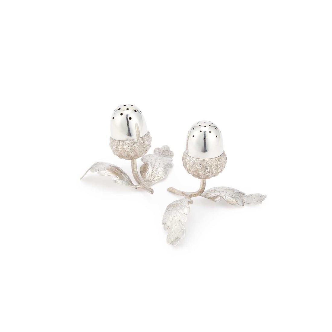 A PAIR OF VICTORIAN SILVER NOVELTY PEPPER POTS: A PAIR OF VICTORIAN SILVER NOVELTY PEPPER POTS by Sampson Mordan & Co, London 1882, modelled as acorns borne on leafy branches. (2) 7.5cm long, 1.9 troy ounces gross