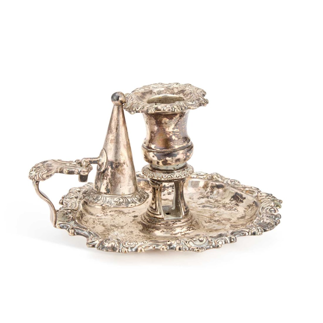 A GEORGE IV SILVER CHAMBERSTICK: A GEORGE IV SILVER CHAMBERSTICK by S C Younge & Co, Sheffield 1824, of shaped circular form with a shell and scroll rim, with original nozzle and snuffer. 15.5cm diameter, 10.4 troy ounces
