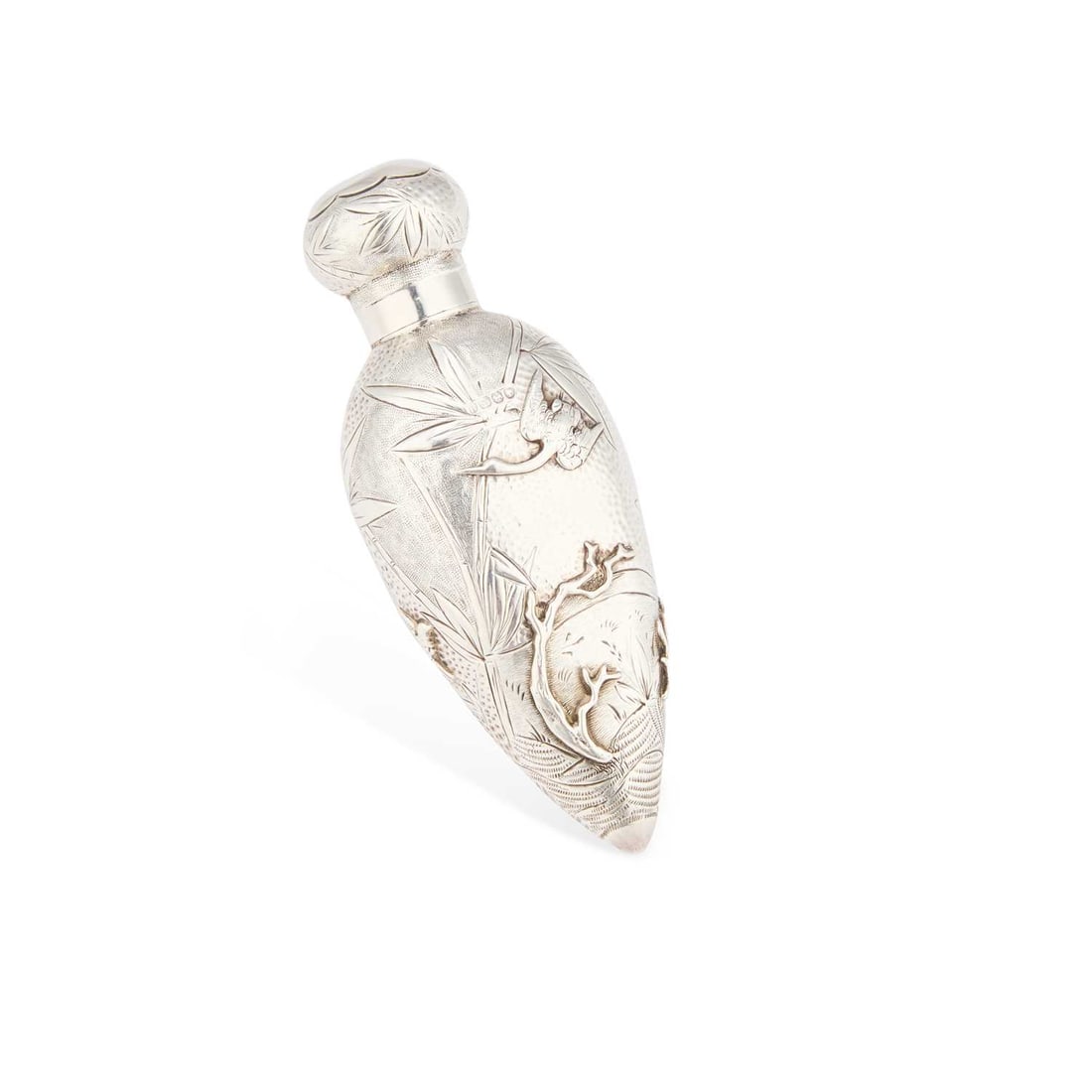 A VICTORIAN AESTHETIC SILVER SCENT BOTTLE: A VICTORIAN AESTHETIC SILVER SCENT BOTTLE by David & Lionel Spiers, Birmingham 1887, of torpedo form with a screw-down cover, chased with cranes, pond life and bamboo. 10cm long, 1.4 troy ounces