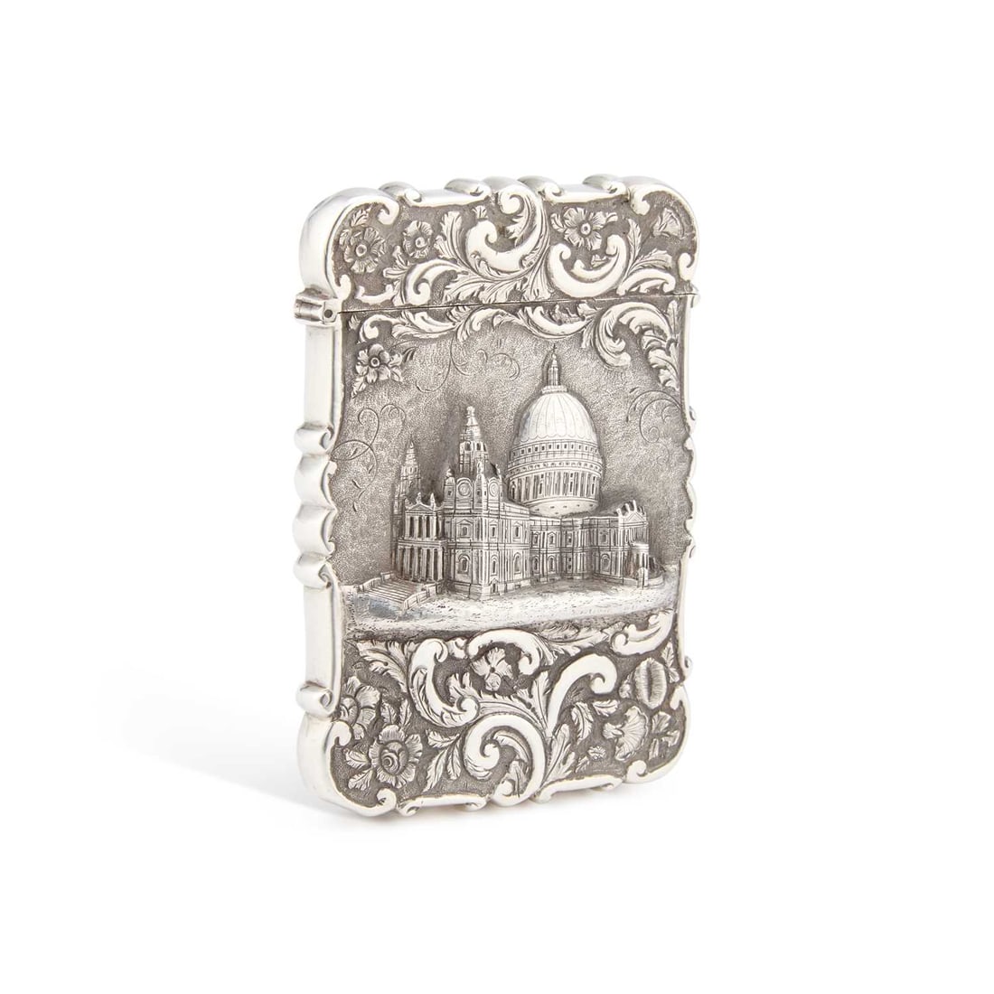 A VICTORIAN SILVER CASTLE-TOP CARD CASE ST PAUL'S CATHEDRAL: A VICTORIAN SILVER CASTLE-TOP CARD CASE ST PAUL'S CATHEDRAL by Nathaniel Mills, Birmingham 1847, rectangular form, the front with a view of the cathedral, within foliate scroll decoration on a matted