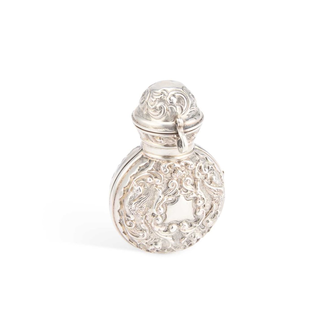 A LATE VICTORIAN SILVER AND GREEN GLASS SCENT BOTTLE: A LATE VICTORIAN SILVER AND GREEN GLASS SCENT BOTTLE by Deakin & Francis Ltd, Birmingham 1900, the hinged silver case chased with scrolls and birds, housing a green glass scent bottle and