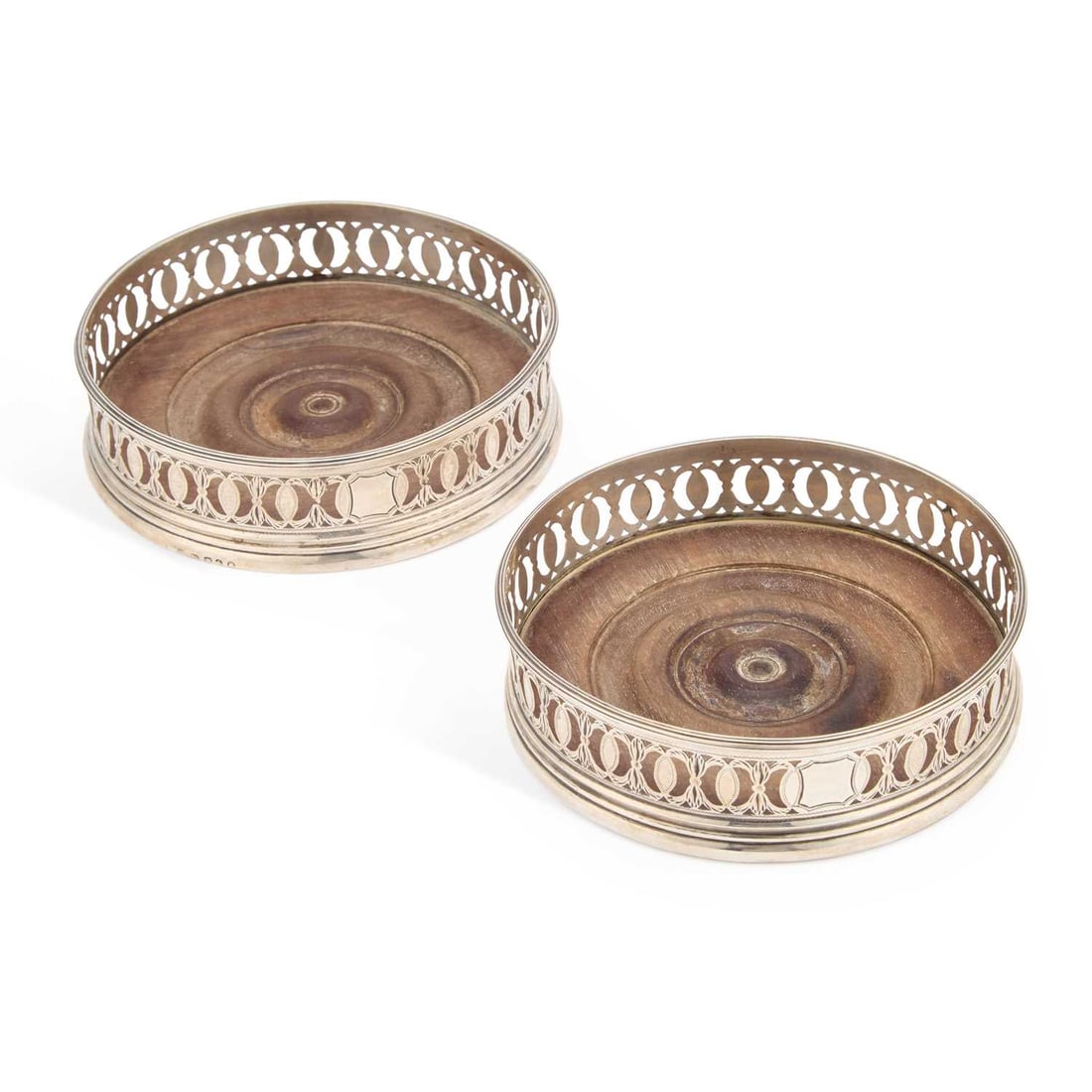 A PAIR OF GEORGE III SILVER BOTTLE COASTERS (1 of 2)