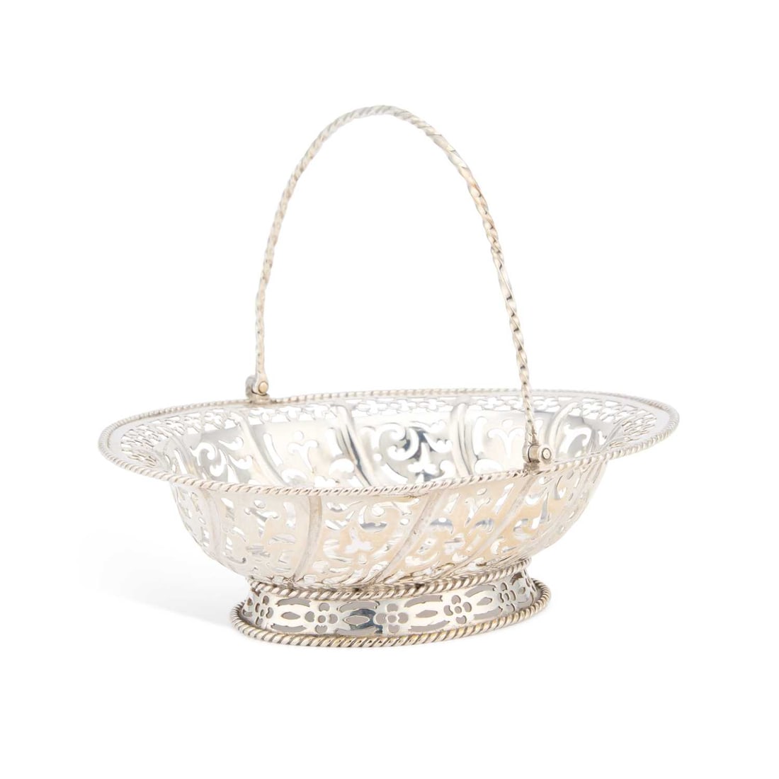 A GEORGE II SILVER SWEETMEAT BASKET: A GEORGE II SILVER SWEETMEAT BASKET by William Plummer, London 1759, of oval form with a twisted swing handle, the bowl with pierced sides within a rope-twist border, raised on a pierced oval foot. 15