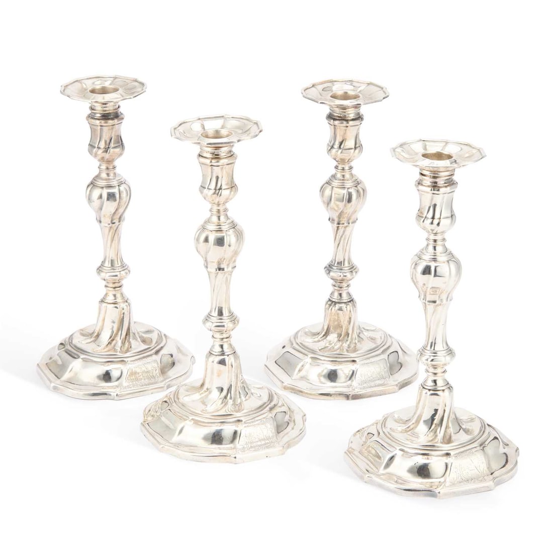A SET OF FOUR GEORGE II CAST SILVER CANDLESTICKS (1 of 4)