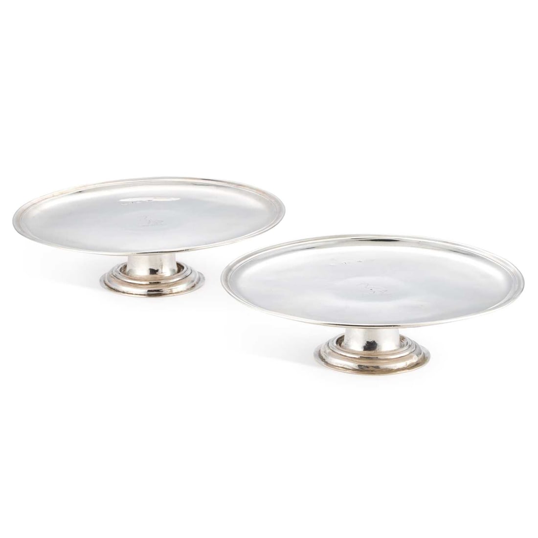 A PAIR OF GEORGE I BRITANNIA STANDARD SILVER TAZZAS: A PAIR OF GEORGE I BRITANNIA STANDARD SILVER TAZZAS by Matthew Lofthouse, London 1720, of circular form with a moulded rim, the field centred with an engraved contemporaneous crest of a stork. (2) 24.