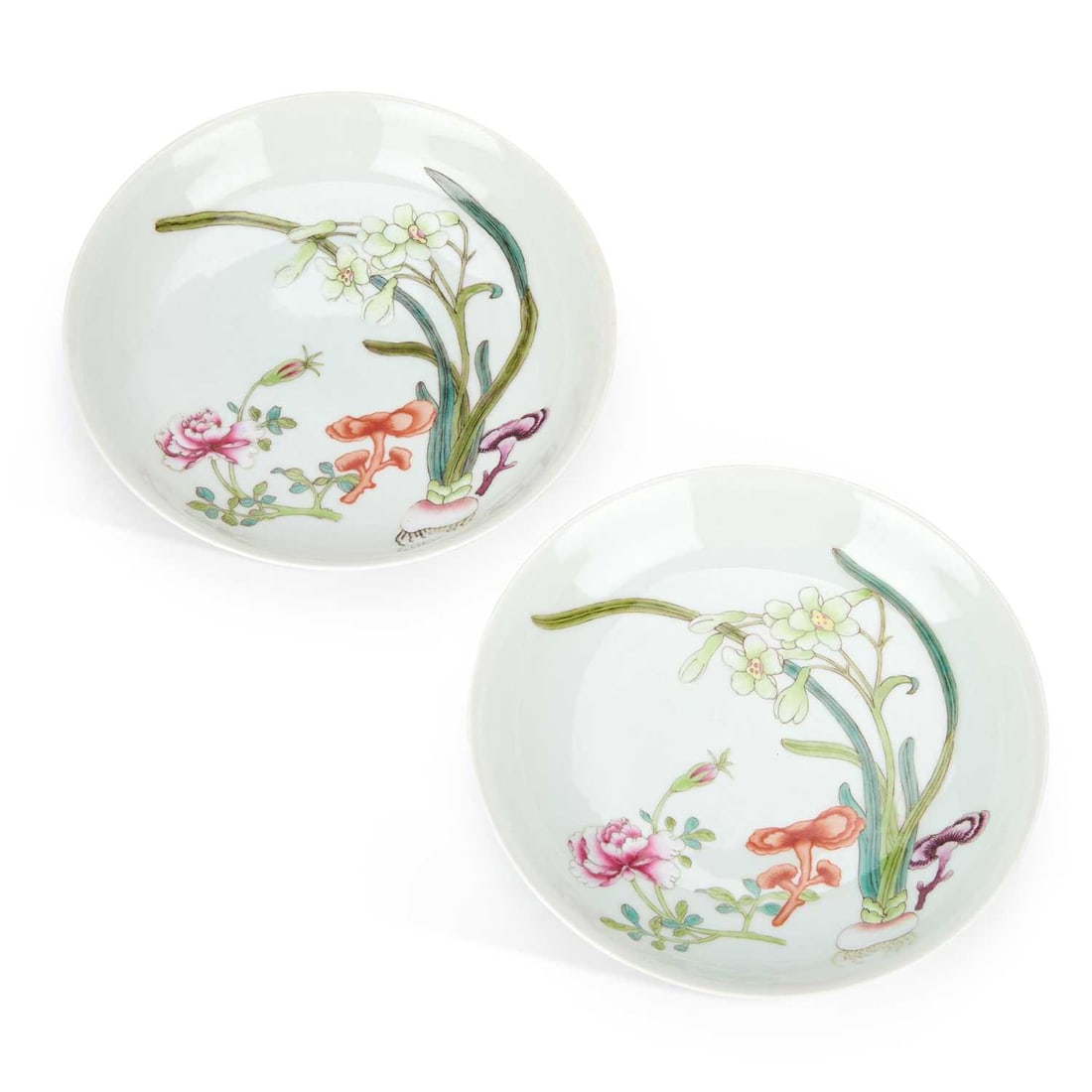 A PAIR OF CHINESE PORCELAIN DISHES: A PAIR OF CHINESE PORCELAIN DISHES both dishes painted with studies of flowering plants, in famille rose enamels and lingzhi, underglaze blue six character Qianlong marks to the reverse. (2) 20.2cm di