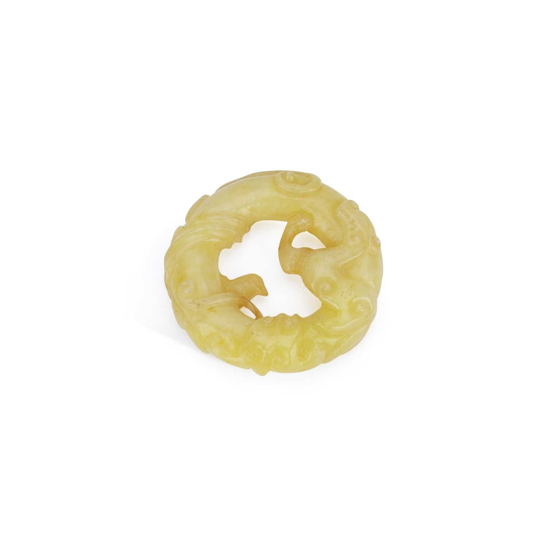 A CHINESE YELLOW JADE ‘CHILONG’ DISC: A CHINESE YELLOW JADE ‘CHILONG’ DISC carved as a chilong dragon forming a circular pendant, the stone of pale yellow tone. 5cm diameter