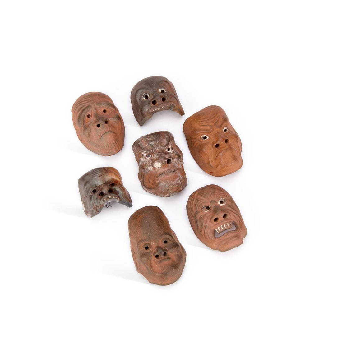 A GROUP OF ONKO-YAKI CERAMIC NOH MASK NETSUKE MEIJI PERIOD (1868-1912) (1 of 2)
