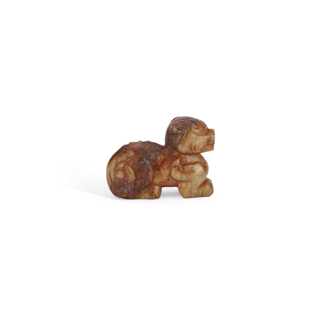 A CHINESE JADE CARVING OF A RECUMBENT MYTHICAL BEAST (1 of 3)