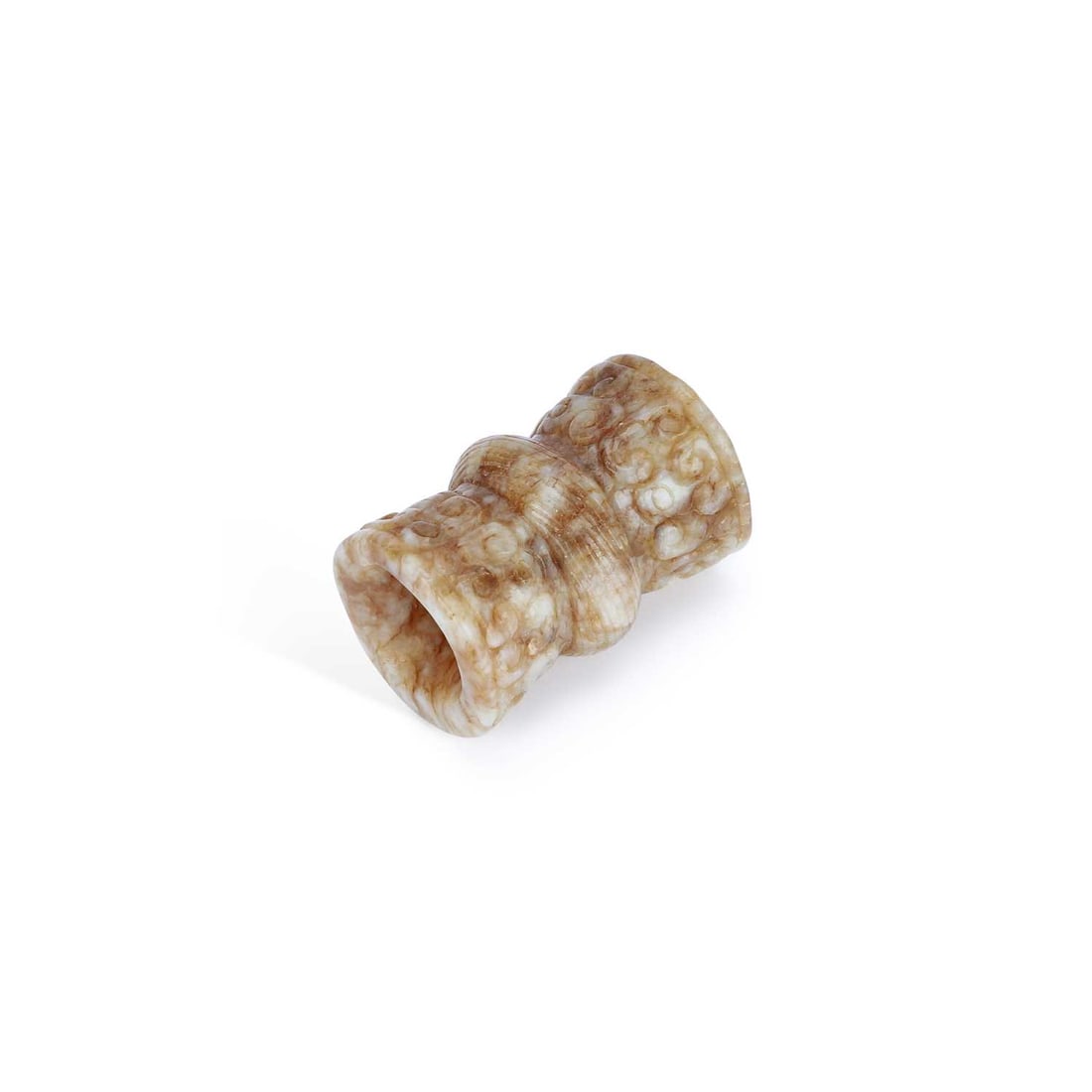 A CHINESE JADE PENDANT: A CHINESE JADE PENDANT of waisted cylindrical form, carved in relief with scrolling archaistic motifs, the stone of mottled cream and russet tone. 3.8cm long