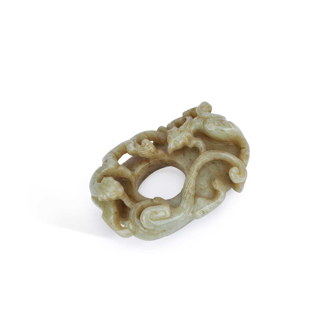 A CHINESE JADE ‘CHILONG’ OPENWORK PENDANT: A CHINESE JADE ‘CHILONG’ OPENWORK PENDANT carved as intertwined chilong and scrolling tendrils around a central aperture, the reverse with incised archaistic motifs, the stone of celadon tone with