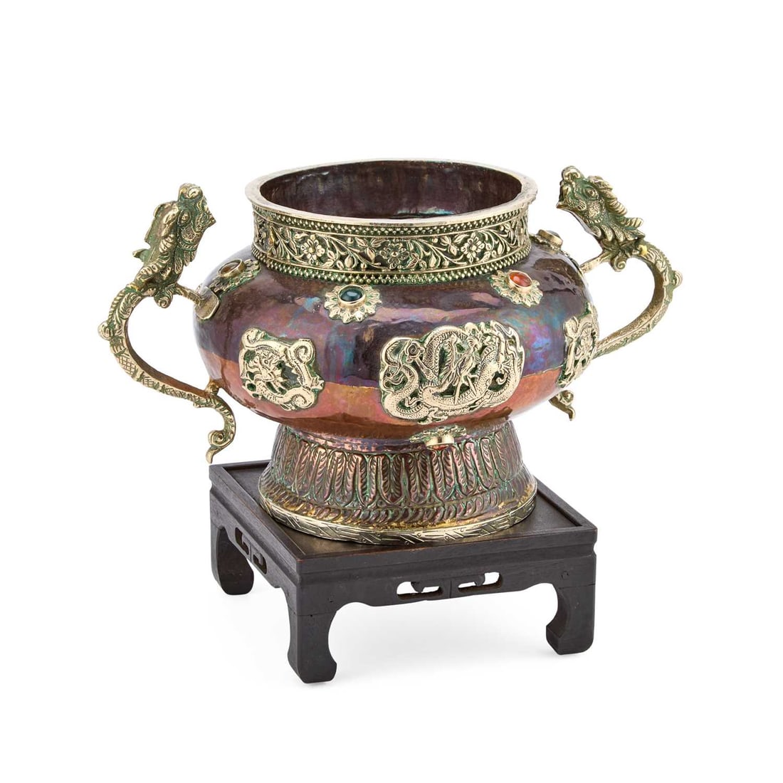 A CHINESE BRASS CENSER QING DYNASTY: A CHINESE BRASS CENSER QING DYNASTY the censer on a lappet decorated foot, mounted with cast gilt metal dragons and set with semi-precious stones, having dragon handles. 16.5cm high, 31cm wide