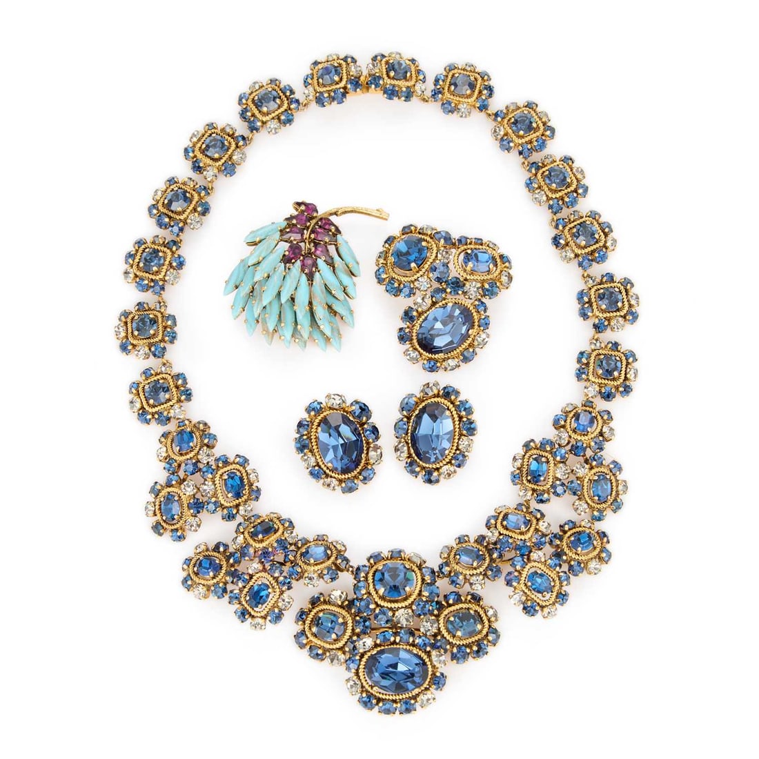A SUITE OF CHRISTIAN DIOR JEWELLERY: A SUITE OF CHRISTIAN DIOR JEWELLERY comprising a blue and white paste cluster necklace, a brooch and a pair of clip earrings, each marked 'Christian Dior' and dated 1964; together with a simulated ame