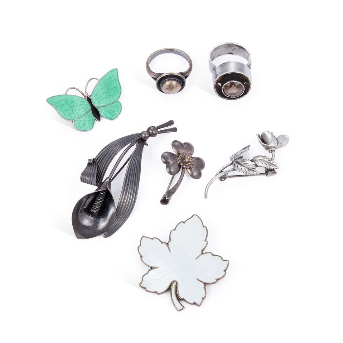 A COLLECTION OF SCANDINAVIAN SILVER JEWELLERY: A COLLECTION OF SCANDINAVIAN SILVER JEWELLERY including an N.E From lily brooch and two rings; a Meka enamel leaf brooch; a Volmer Bahner enamel butterfly brooch; and a Hermann Siersbol brooch; etc. (