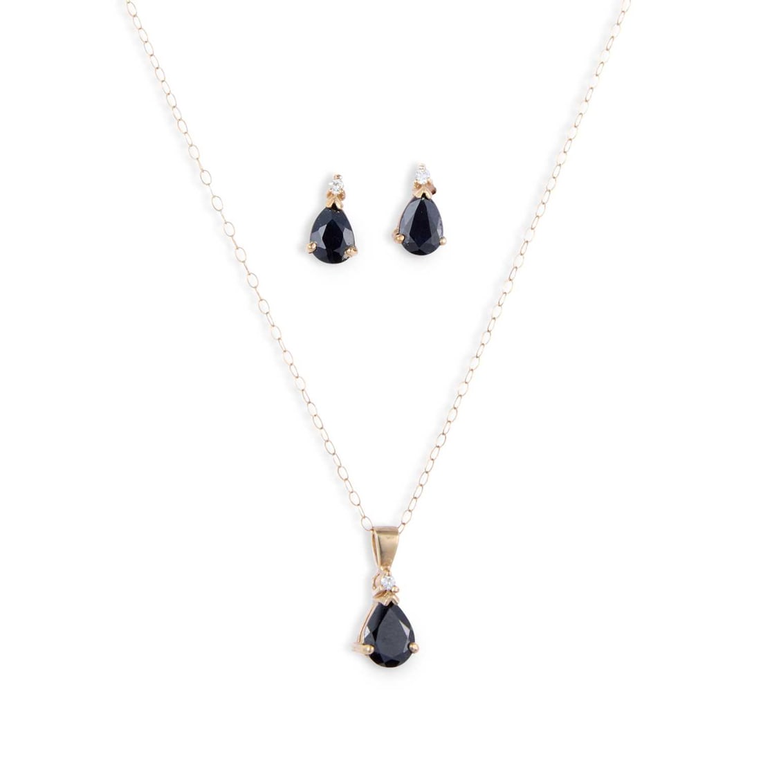 A SAPPHIRE AND DIAMOND PENDANT ON CHAIN AND EARRINGS SET: A SAPPHIRE AND DIAMOND PENDANT ON CHAIN AND EARRINGS SET with pear-cut sapphires each topped by a round brilliant-cut diamond, the pendant to a fine chain, earrings with post-fittings, stamped '375'. 