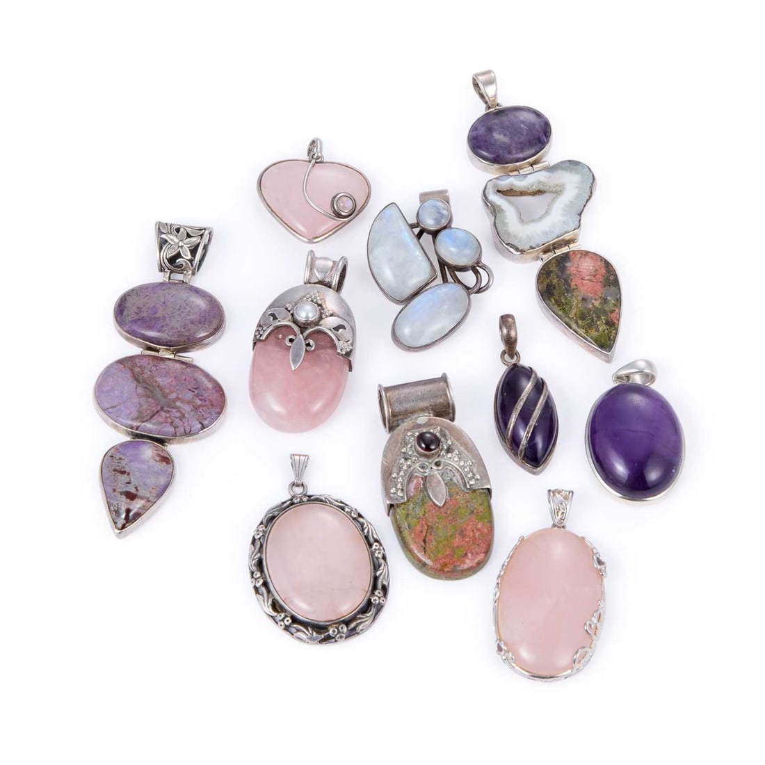 A GROUP OF GEM-SET SILVER PENDANTS: A GROUP OF GEM-SET SILVER PENDANTS including a heart-shaped rose quartz example; another with an oval cabochon amethyst; etc. (10) Largest 9.5cm long, 214.8 grams gross