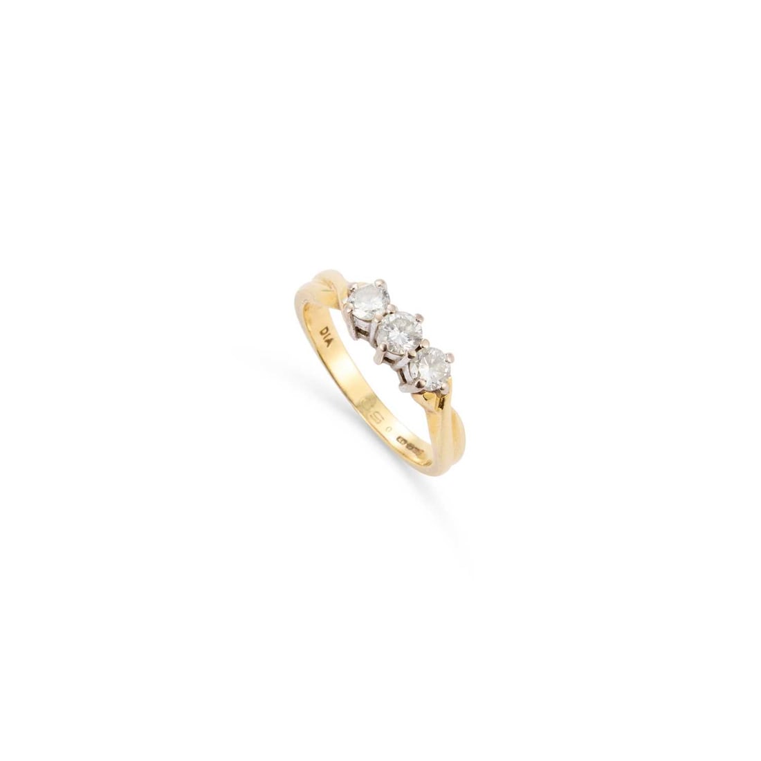 AN 18 CARAT GOLD DIAMOND THREE STONE RING: AN 18 CARAT GOLD DIAMOND THREE STONE RING round brilliant-cut diamonds to twisted shoulders, hallmarked London. Stated diamond weight 0.50 carat, ring size L1/2, 3.7 grams Good condition. Estimated