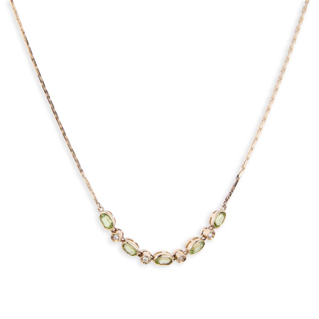 A 9 CARAT GOLD PERIDOT AND DIAMOND NECKLACE: A 9 CARAT GOLD PERIDOT AND DIAMOND NECKLACE oval-cut peridot alternating with round brilliant-cut diamonds to a fancy link chain, hallmarked. 40cm long, 5.5 grams