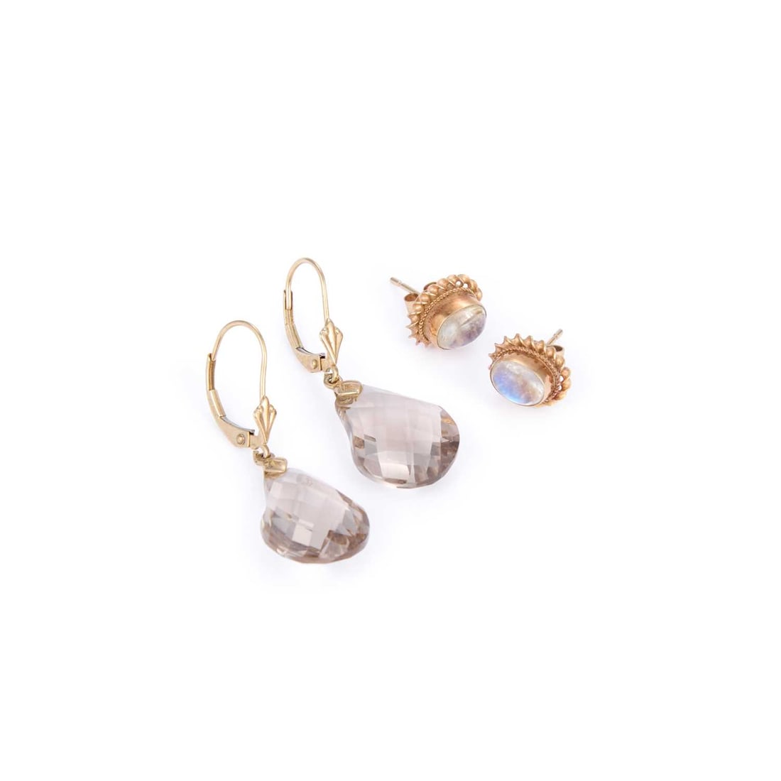 TWO PAIRS OF GEM-SET EARRINGS: TWO PAIRS OF GEM-SET EARRINGS comprising a pair of 9 carat gold moonstone stud earrings, with post fittings hallmarked; and a pair of mixed-cut smoky quartz pendant earrings, with hook fittings, stamp
