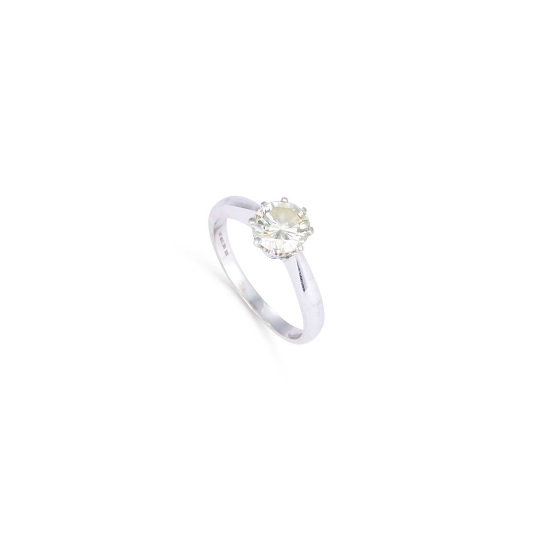 A SOLITAIRE DIAMOND RING: A SOLITAIRE DIAMOND RING a round brilliant-cut diamond in a claw setting, stamped '18CT'. Estimated diamond weight 1.20 carat, ring size O1/2, 4.5 grams Good condition. Estimated diamond colour: M/N, 