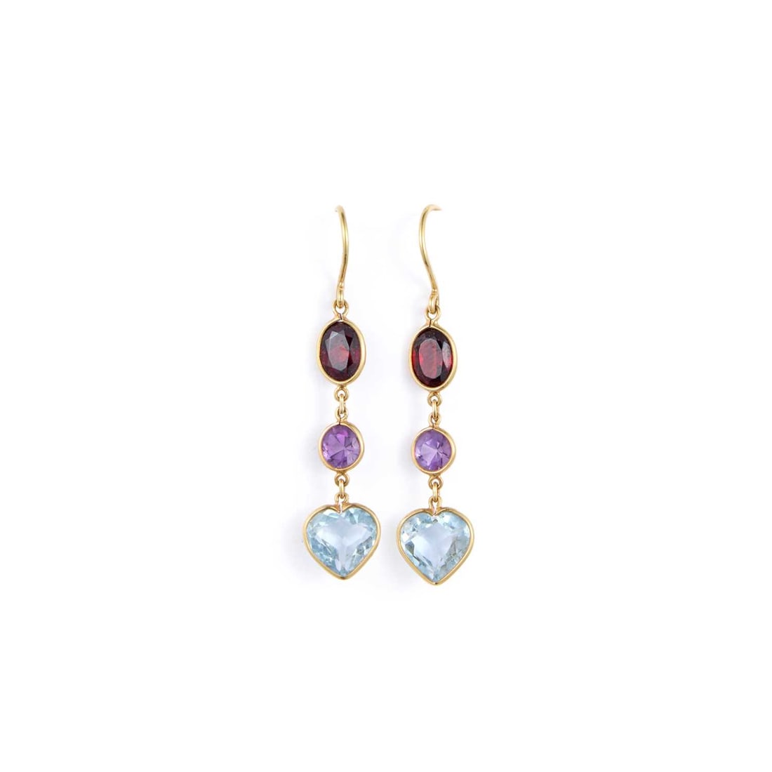 A PAIR OF GARNET, AMETHYST AND BLUE TOPAZ PENDANT EARRINGS: A PAIR OF GARNET, AMETHYST AND BLUE TOPAZ PENDANT EARRINGS a line of oval-cut garnets, round-cut amethysts and heart-cut blue topaz, with hook fittings, stamped '18K'. 4.5cm long, 3.9 grams Good