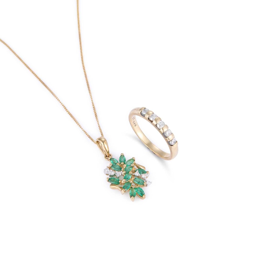 A 9 CARAT GOLD DIAMOND FIVE STONE RING AND AN EMERALD AND DIAMOND PENDANT ON CHAIN: A 9 CARAT GOLD DIAMOND FIVE STONE RING AND AN EMERALD AND DIAMOND PENDANT ON CHAIN comprising the ring featuring round brilliant-cut diamonds in tension settings, hallmarked Birmingham; the pendant