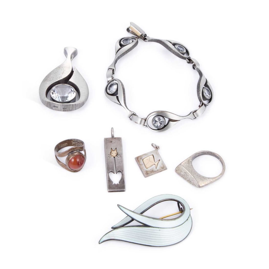 A GROUP OF SCANDINAVIAN JEWELLERY: A GROUP OF SCANDINAVIAN JEWELLERY including a Sten & Laine Finnish pendant and bracelet set; an Albert Scharning enamel brooch; two Nina Breddal pendants; etc. (Qty) Pendants 5.5cm long and
