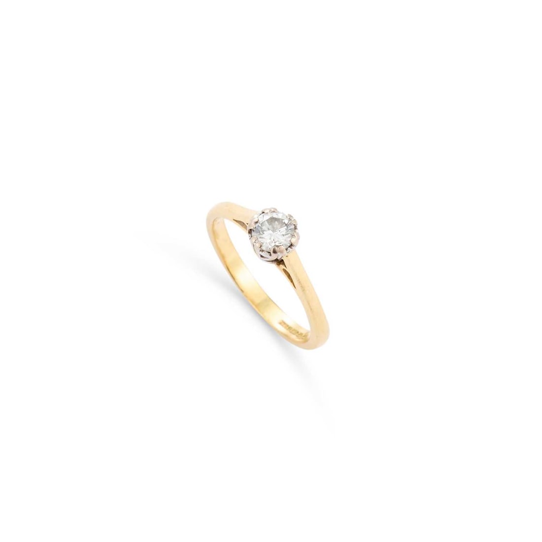 AN 18 CARAT GOLD SOLITAIRE DIAMOND RING: AN 18 CARAT GOLD SOLITAIRE DIAMOND RING a round brilliant-cut diamond in a claw setting, hallmarked Birmingham. Stated diamond weight 0.33 carat, ring size I1/2, 2.6 grams Good condition. Estimated di