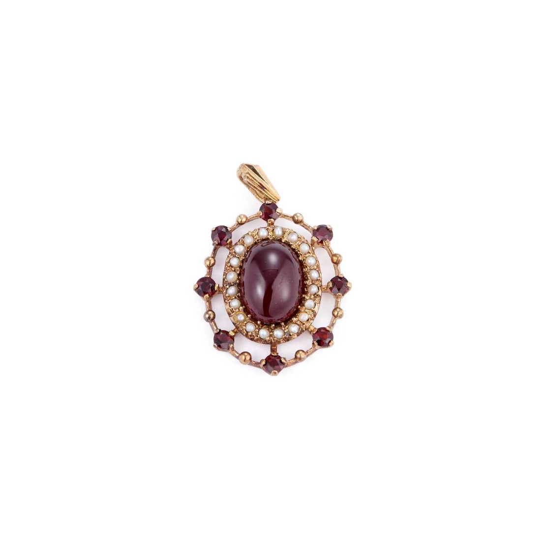 AN ANTIQUE STYLE GARNET AND SEED PEARL PENDANT: AN ANTIQUE STYLE GARNET AND SEED PEARL PENDANT an oval carbuncle garnet within a border of seed pearls and a frame of round-cut garnets, stamped '375'. 3.5cm long, 6.1 grams Good condition