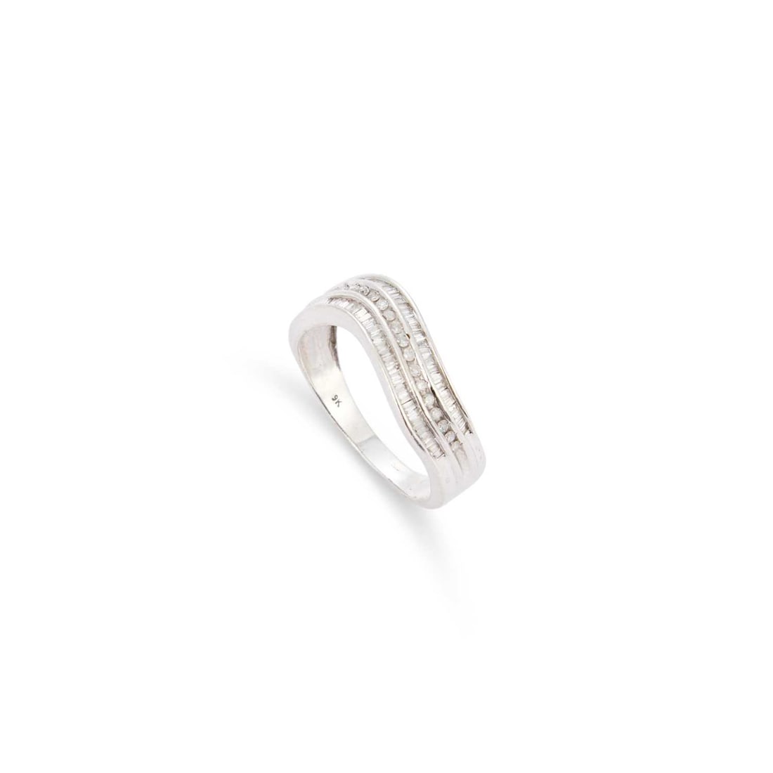 A DIAMOND BAND RING: A DIAMOND BAND RING a band of round brilliant-cut diamonds flanked by bands of baguette-cut diamonds, stamped '9K'. Estimated total diamond weight 0.60 carat, ring size P, 3.5 grams Good condition.