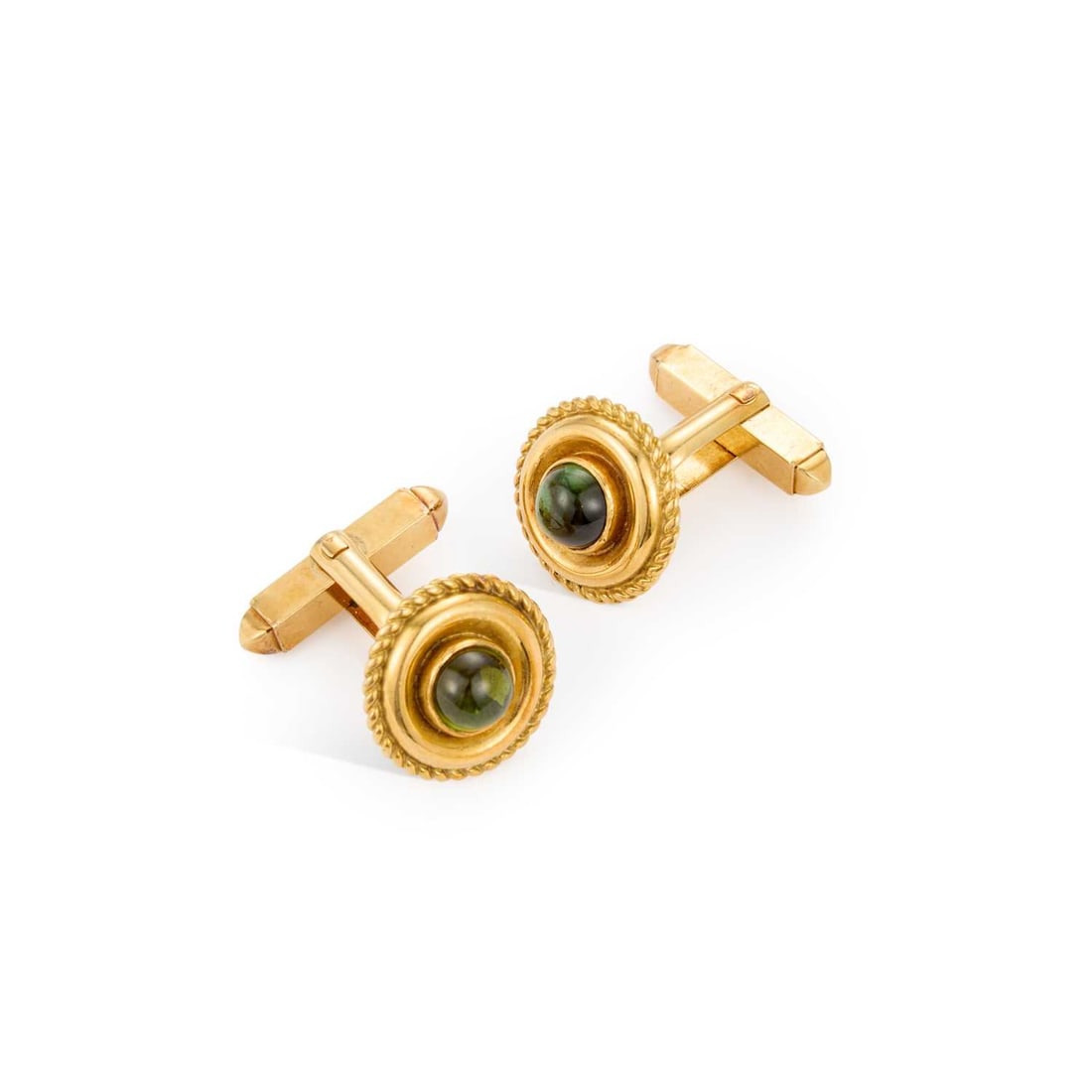 A PAIR OF PERIDOT CUFFLINKS: A PAIR OF PERIDOT CUFFLINKS round cabochon peridot inset to circular rope pattern frames, with swivel fittings, unmarked. 1.6cm diameter, 13.4 grams Good condition